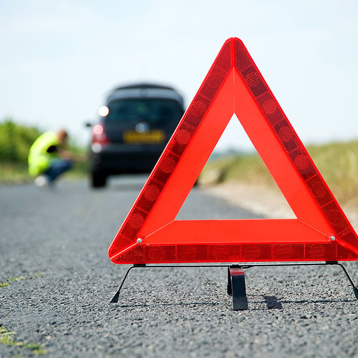 Road Side Warning Triangle Behind a Car Stock Image